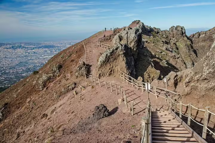 Hiking trail and stairs on Mount Vesuvius rim with Naples views, Vesuvius tour from Naples group trip