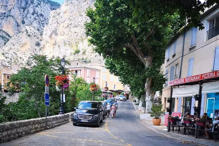 Moustiers-Sainte-Marie street scene on private day trip from Marseille, Provence village by the cliffs