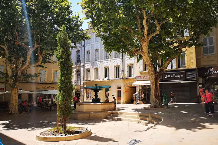 Shaded village square in Moustiers-Sainte-Marie, Provence stop on private day trip from Marseille