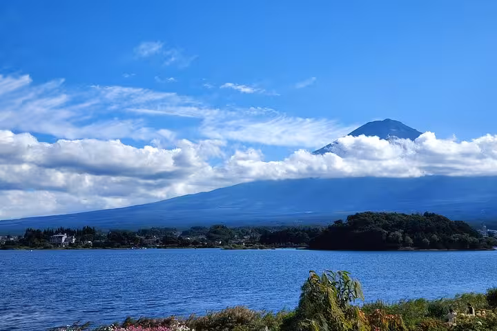Serene lake view with Mt. Fuji rising majestically, perfect for a two-day guided tour experience.