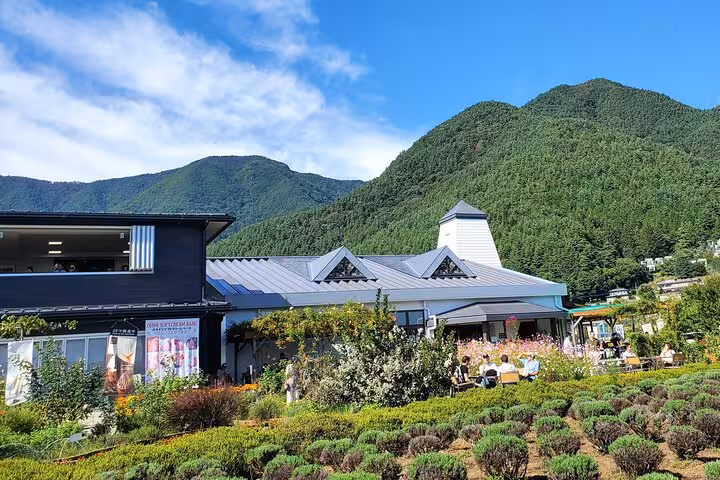 Charming building surrounded by lush greenery, perfect for a Mt. Fuji and Hakone private tour experience.