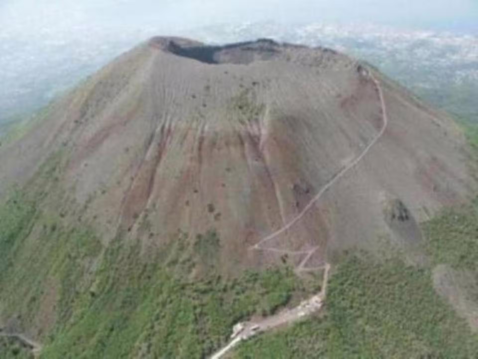 Aerial view of Mt. Vesuvius crater and hiking trail featured on a private full‑day Pompeii and Vesuvius winery tour