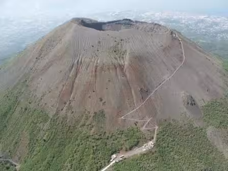 Aerial view of Mt. Vesuvius crater and summit trail, ideal for a private half-day guided tour from Naples