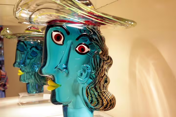 Artistic blue glass sculpture on display in Murano, showcasing the craftsmanship on the Private LimoBoat Tour.