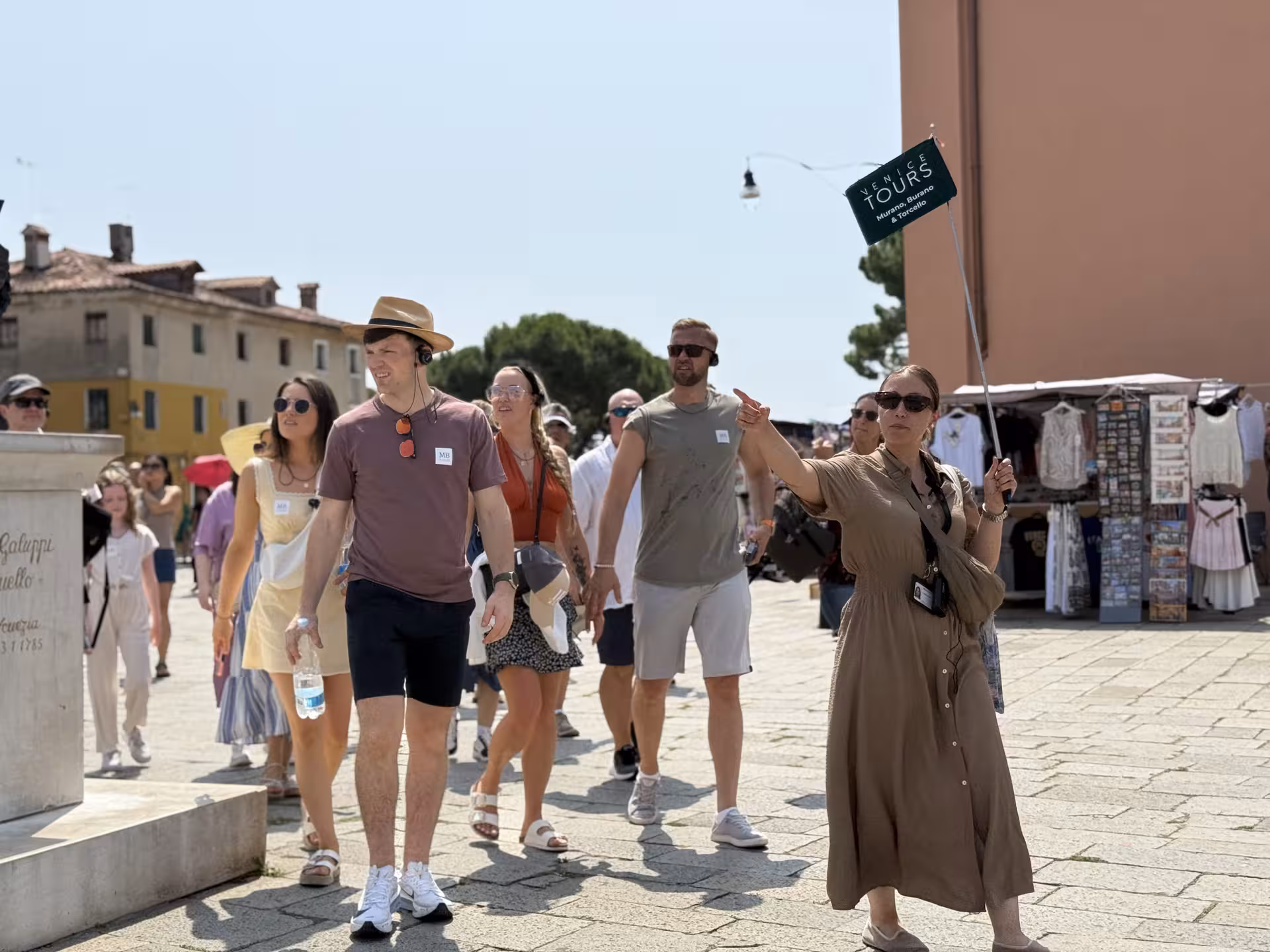 Visitors enjoy guided walking tour of Murano and Burano, exploring vibrant culture and iconic Venetian landmarks.