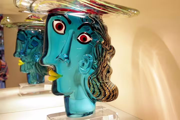 Intricately designed Murano glass sculpture with vivid colors featured on the Burano and Murano tour.