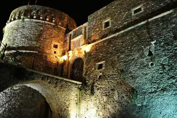 Night view of illuminated Murat Castle in Pizzo Calabro, a highlight of the private guided walking tour in Calabria, Italy
