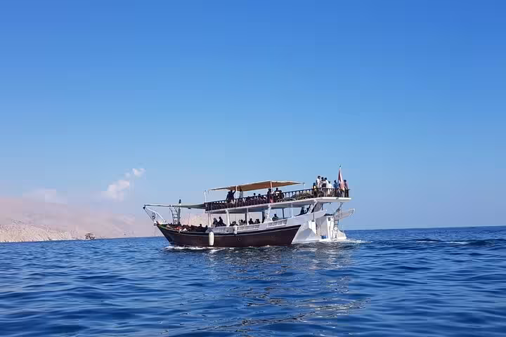 Traditional dhow cruising Musandam fjords, Oman boat trip with snorkeling, fishing and lunch on board