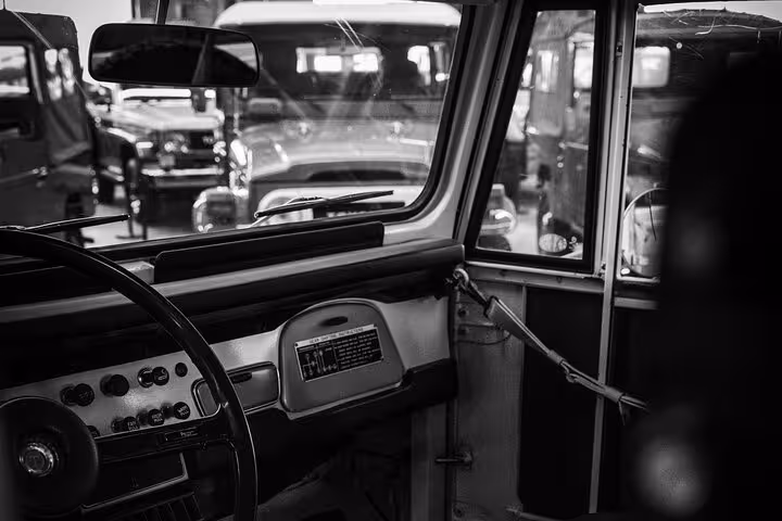 Comfortable modern car interior used for Muscat airport transfer, showcasing clean dashboard, steering wheel and private ride setting