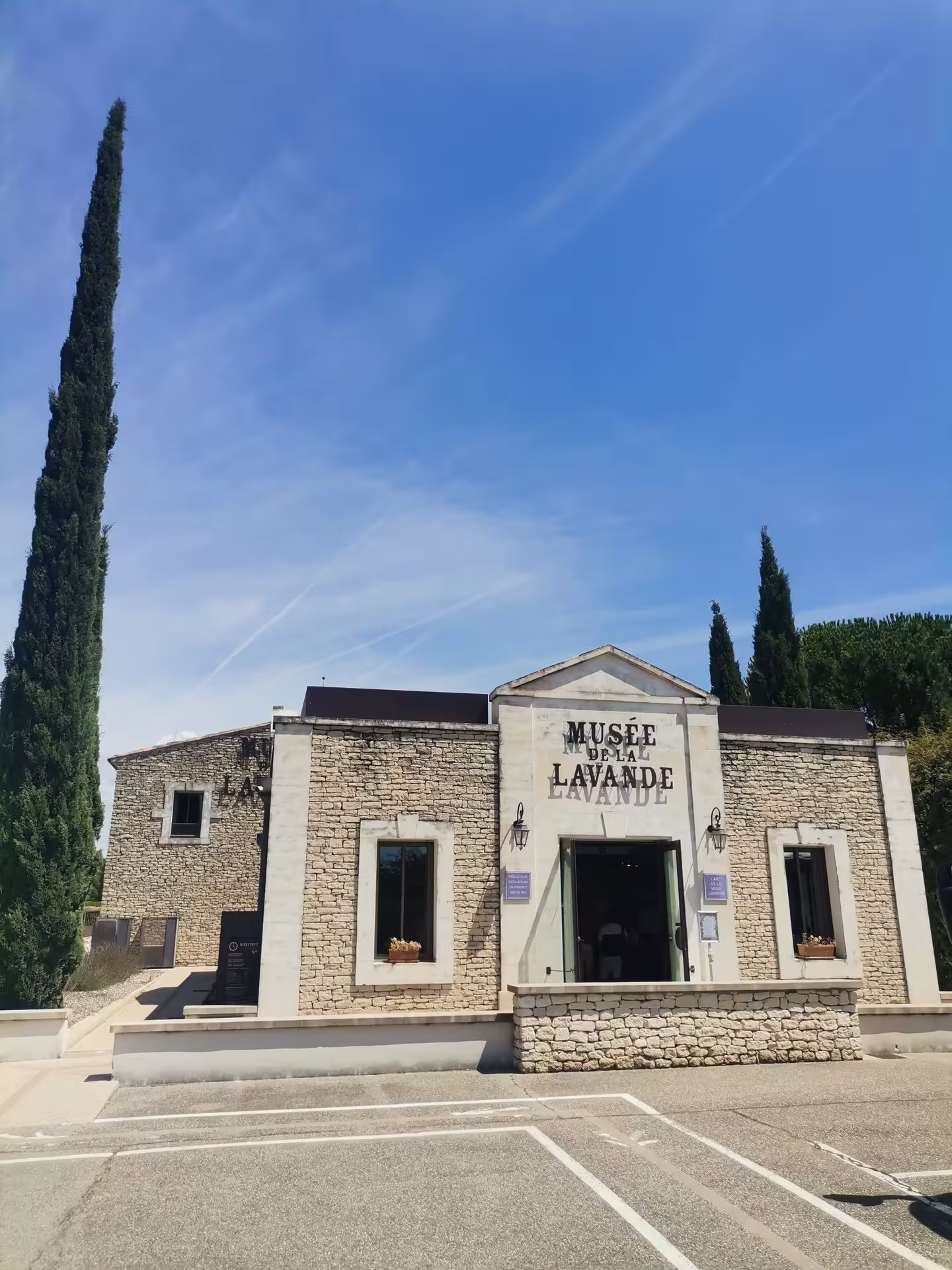 Exterior of Musée de la Lavande in Provence, a stop on the lavender field experience tour under blue sky