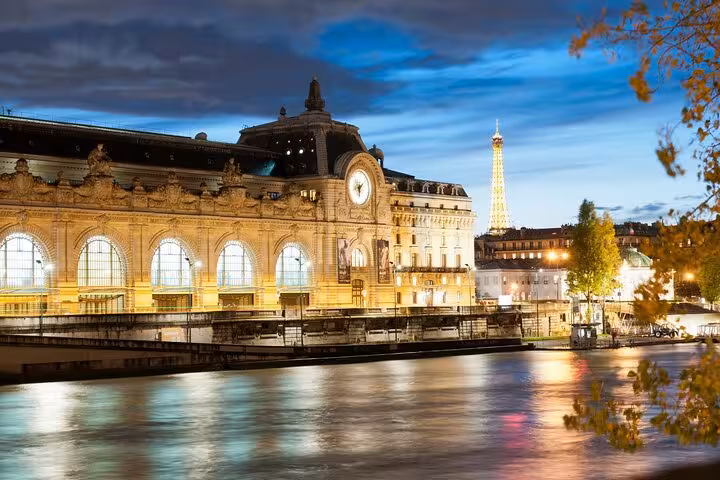 Musée d'Orsay riverside at dusk on a private Seine walk, with Eiffel Tower views and timed-entry tickets