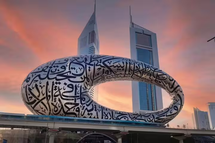 Futuristic Museum of the Future with Arabic calligraphy at sunset in Dubai, a highlight of the modern city tour.