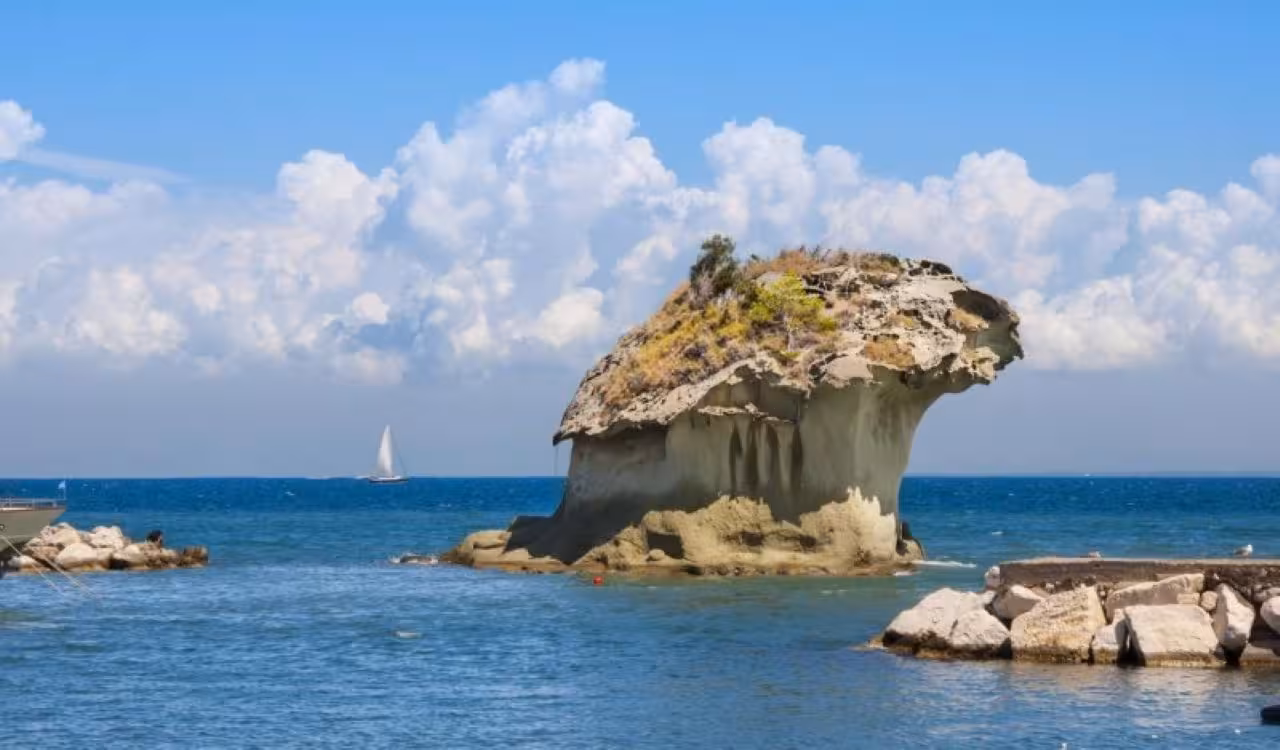 Mushroom-shaped sea rock at Lacco Ameno, Ischia, seen on Naples to Ischia round-trip hydrofoil excursion