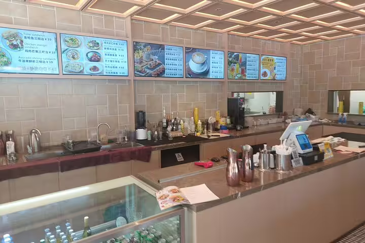 Modern restaurant interior with menu displays, part of the Mutianyu Great Wall private day tour package.