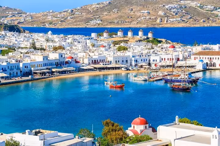 Mykonos Town harbor view with whitewashed houses and windmills on a 5-day private Athens island tour