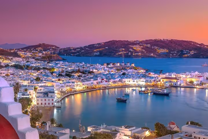 Mykonos Town sunset harbor lights panorama, romantic 5 Senses Experience Journey shore excursion from cruise