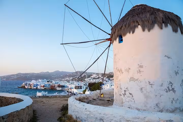 Mykonos windmill overlooking Little Venice waterfront, highlight of 2-day Athens to Santorini and Mykonos tour