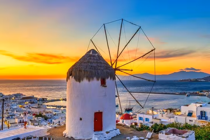 Mykonos windmill at sunset above Chora, a highlight stop on a small group Mykonos island tour