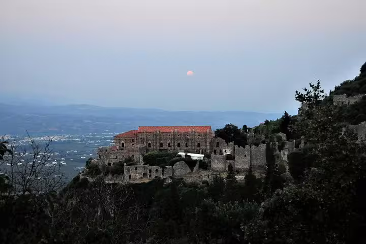 Mystras Byzantine fortress at dusk overlooking Sparta valley on full-day Ancient Sparta, Kaiadas tour with meal