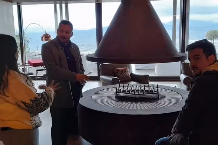 Guests relax in a stylish lounge on a private day trip to Nafplio from Athens with scenic sea views