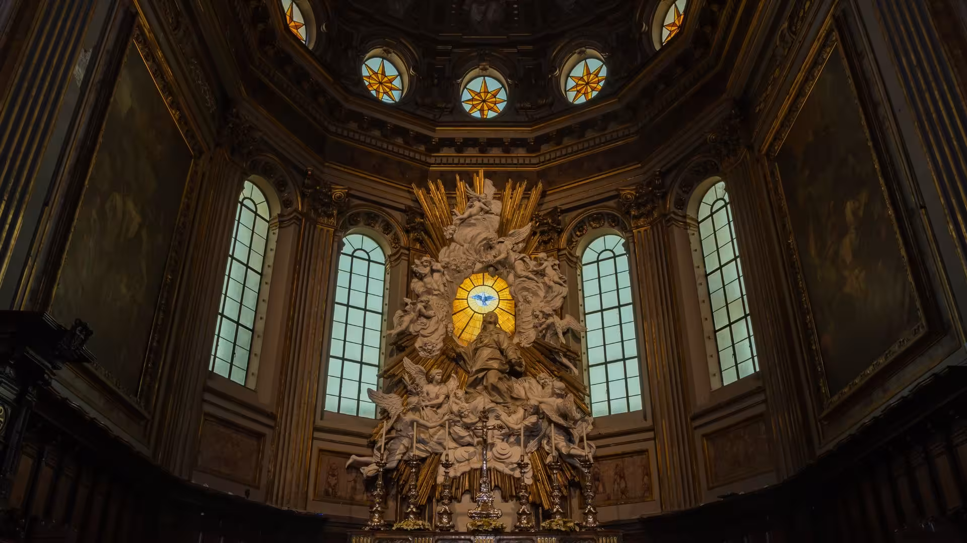 Marvel at the stunning baroque altar adorned with sculptures and stained glass in a Naples ancient ruins tour.