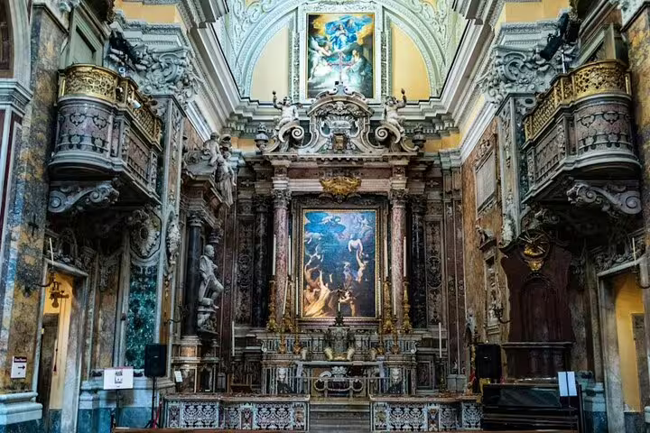 Ornate Baroque altar and frescoes inside a historic Naples church on the Legends of Naples walking tour