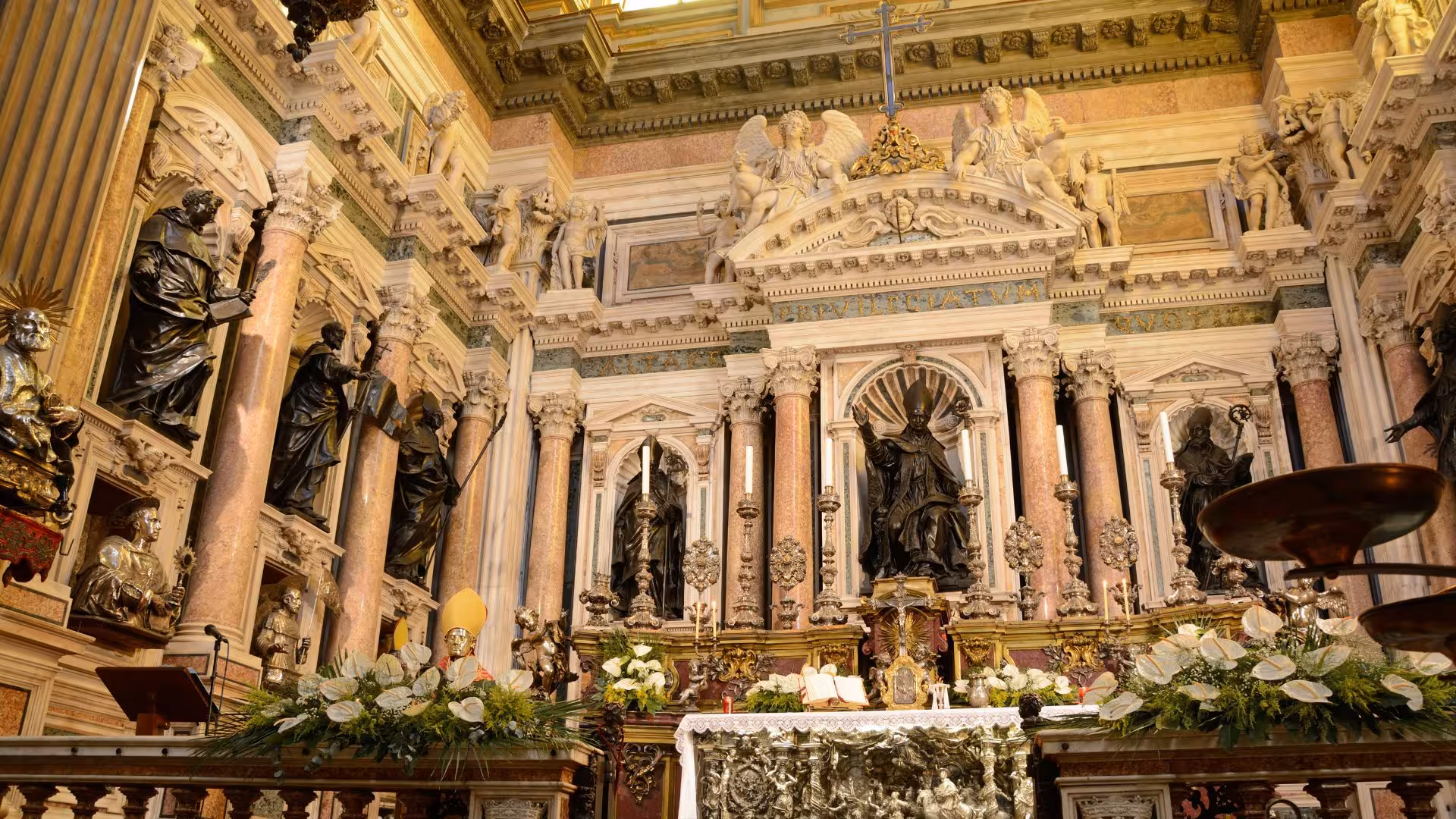 Discover the elaborate marble carvings and statues in a richly decorated chapel on a Naples guided tour.