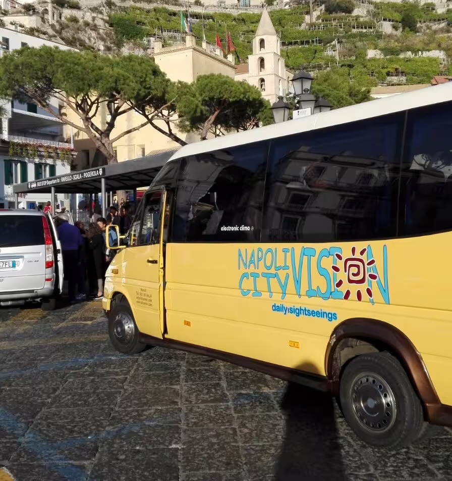 Naples City Vision minibus pickup for low cost Herculaneum tour from Naples, shared transfer meeting point