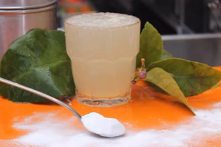 Refreshing lemon drink with sugar on a vibrant table, capturing the essence of Naples' zesty beverages.