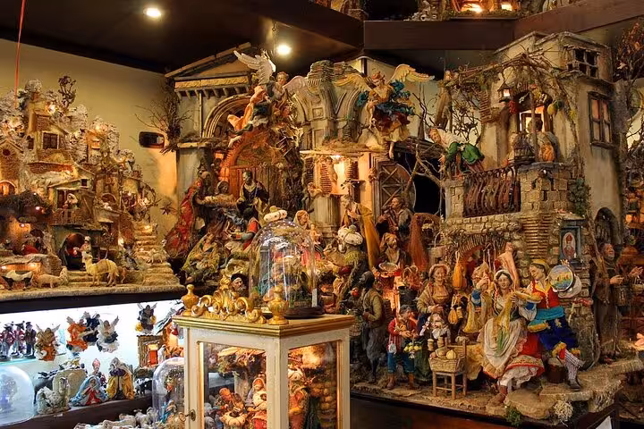 Intricate nativity scenes displayed in a Naples artisan shop, showcasing traditional Italian craftsmanship.