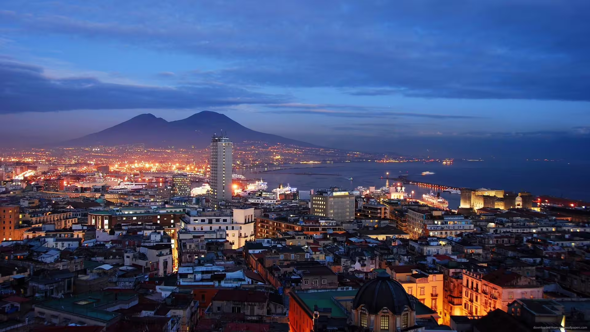 Naples skyline at dusk with Mount Vesuvius and the bay, featured on the low cost Pompeii & Naples tour