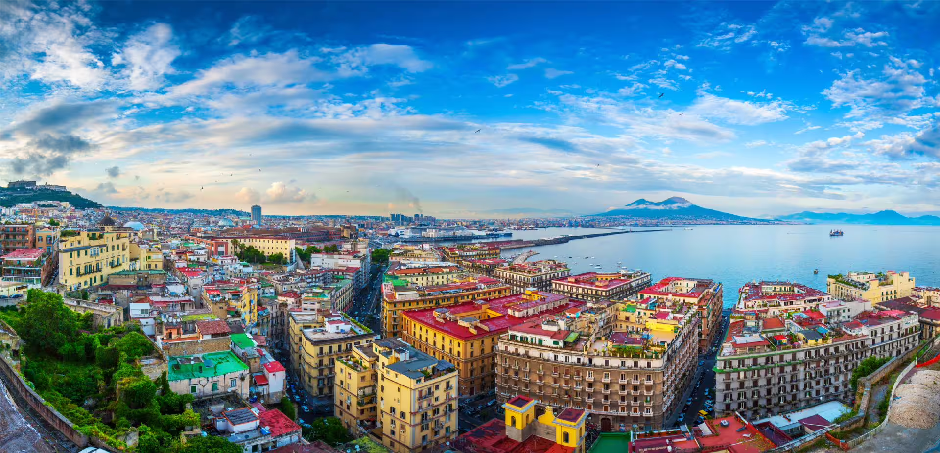 Panoramic Naples skyline and Gulf of Naples with Mount Vesuvius, seen on a daylight sightseeing bus tour
