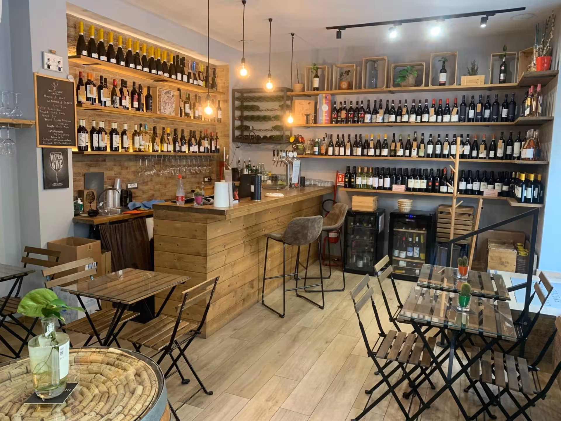 Cozy Naples wine bar with rustic decor, featuring shelves of local wines for tasting and pairing experiences.