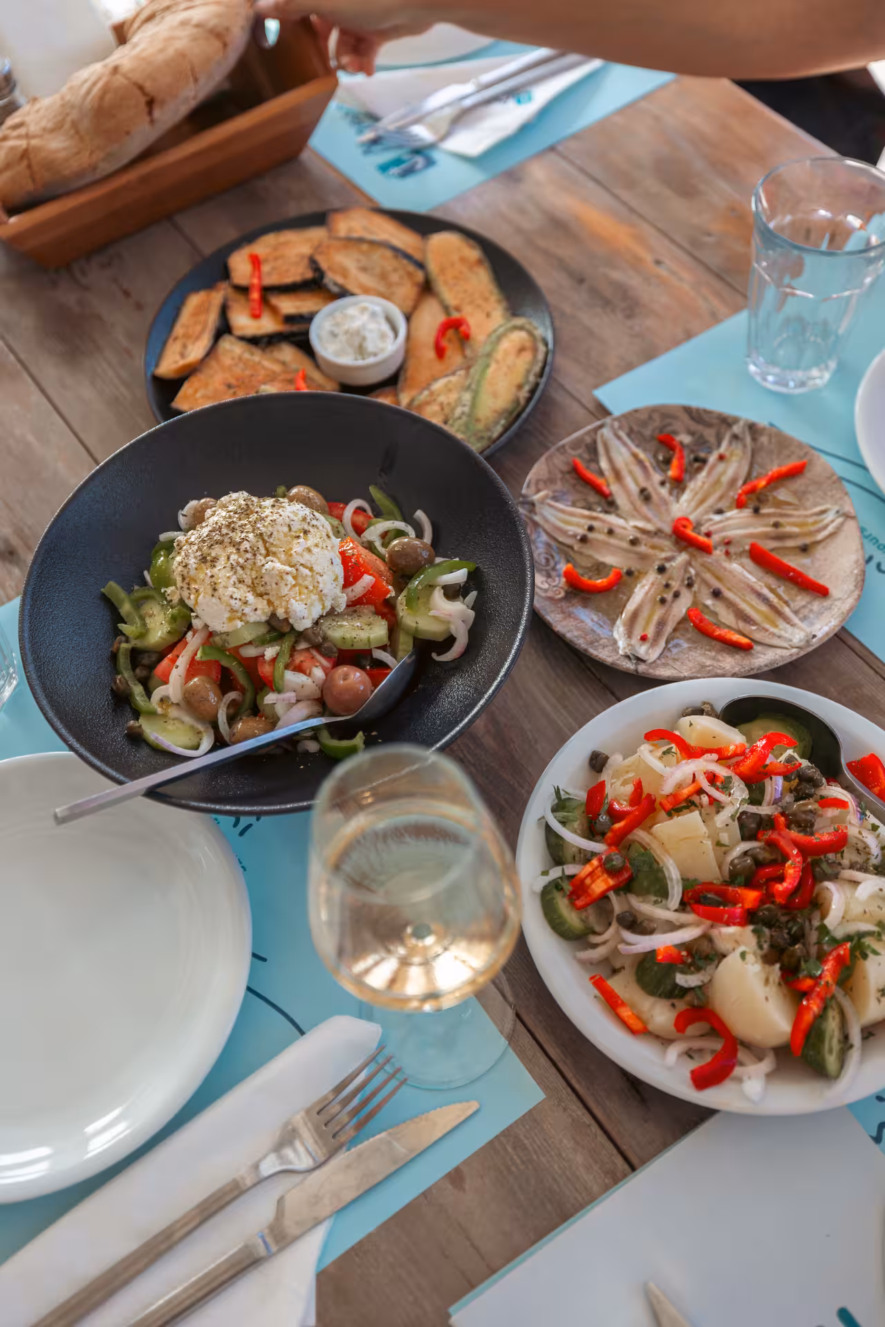 Greek meze spread with Naxos salad, anchovies and fried eggplant, a highlight of the Naxos Town food tour