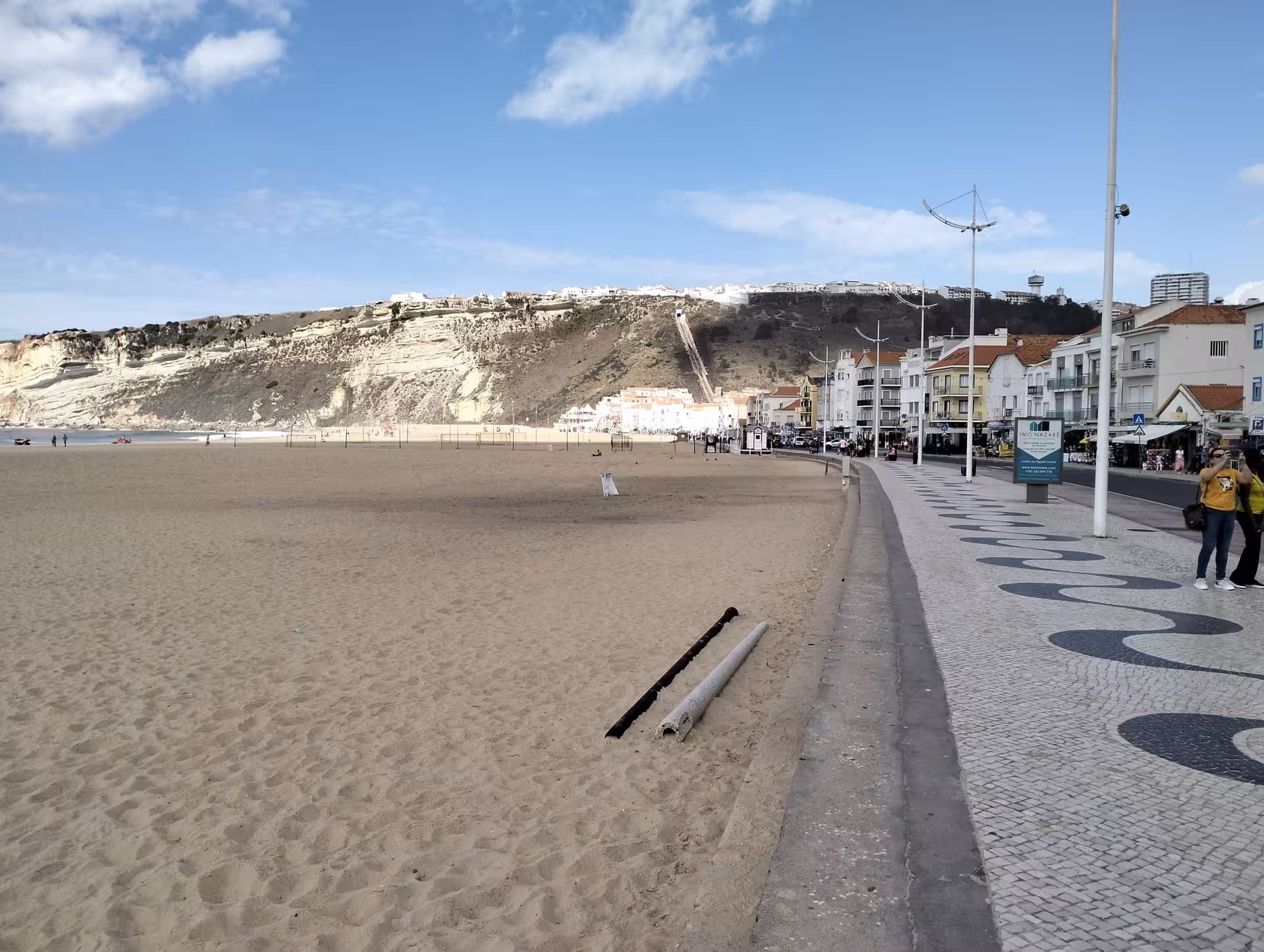Nazaré seafront promenade and sandy Praia da Nazaré, coastal stop on Porto to Lisbon private transfer