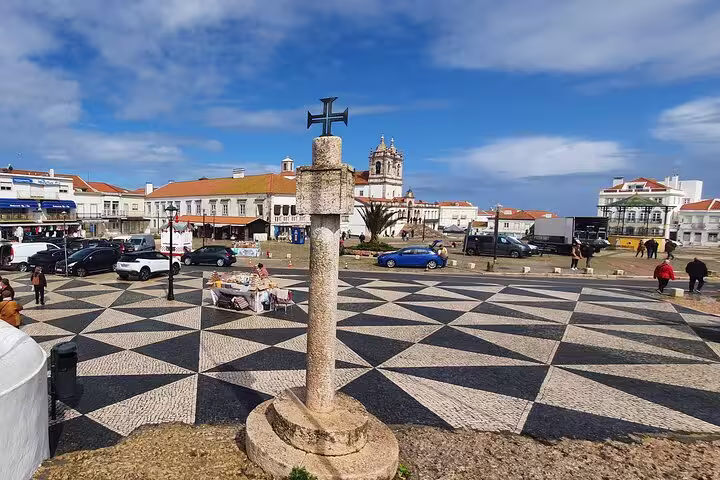 Scenic view of Nazaré town square with traditional Portuguese architecture, captured during a Fátima, Batalha, Nazaré & Óbidos private tour.