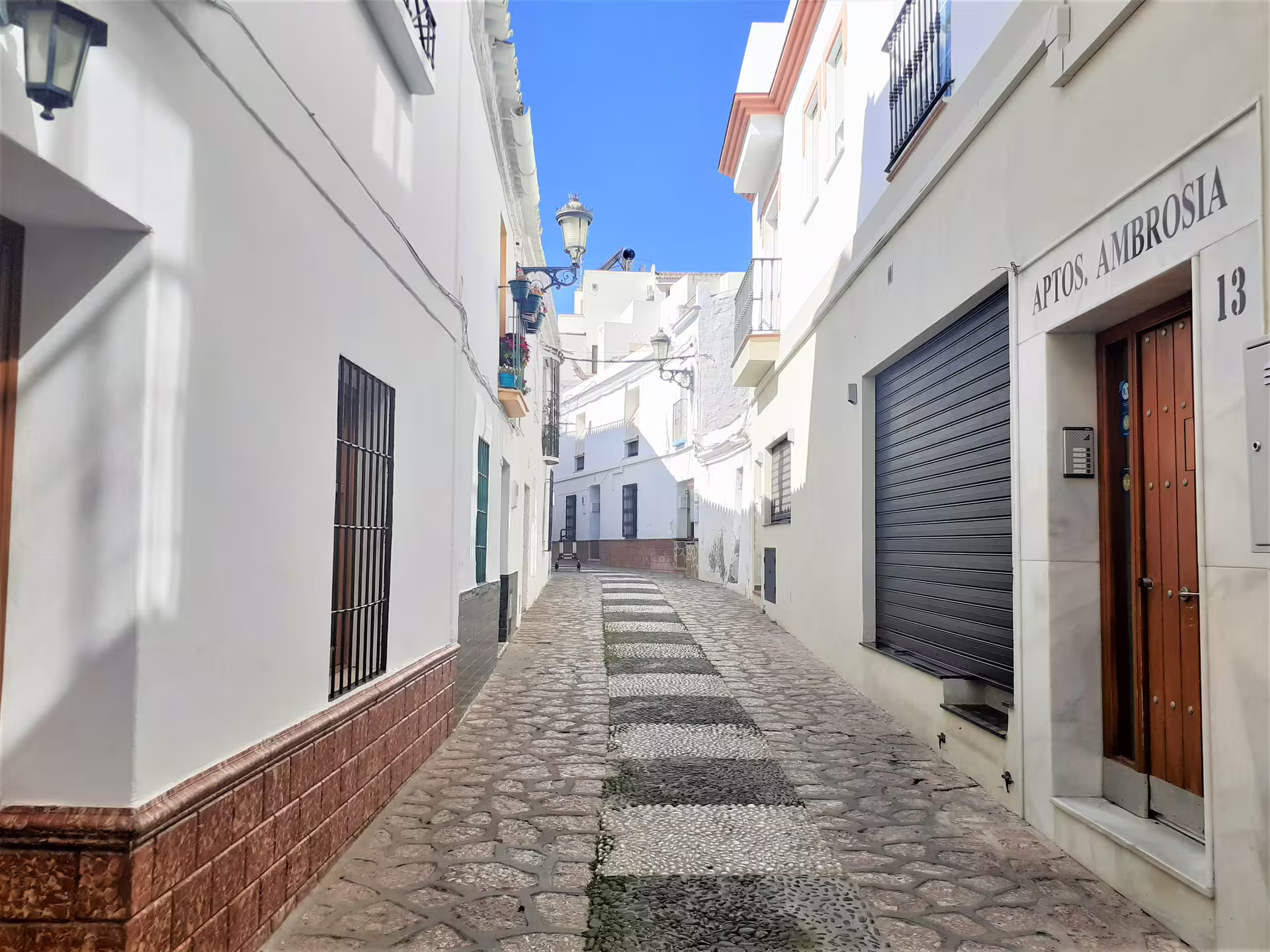 Narrow cobblestone lane in Nerja Andalusia, perfect for a private walking tour from Malaga with local guide