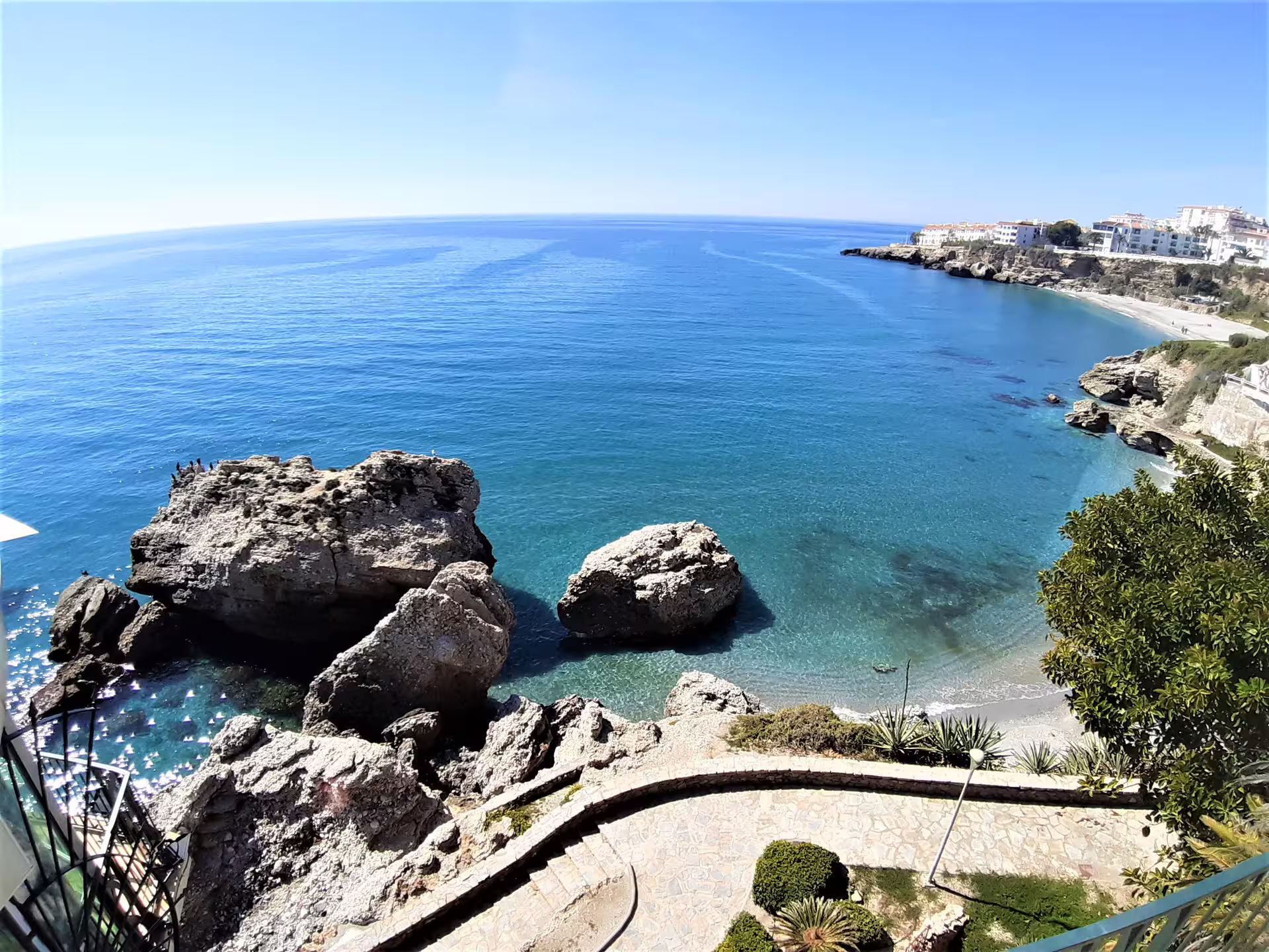 Rocky cove and turquoise sea in Nerja, Costa del Sol, photographed on a private tour from Malaga