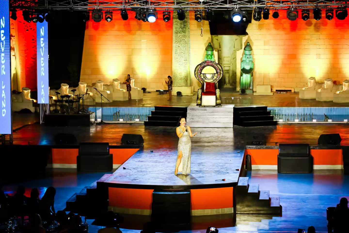 Singer performing on Neverland Show Sharm El Sheikh stage with Egyptian set, live music and spotlights