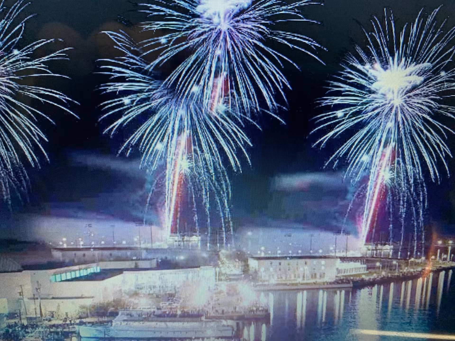 New Year’s Eve sailboat cruise with waterfront fireworks over marina skyline, midnight celebration at sea