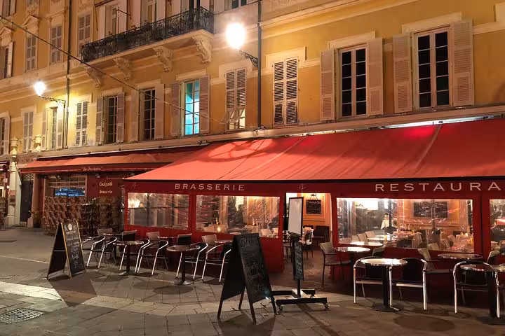 Charming brasserie in Nice with outdoor seating, perfect for a cozy culinary experience on a food tour.