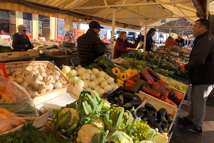 Vibrant local market in Nice showcasing fresh produce, ideal for a private food tour experience.