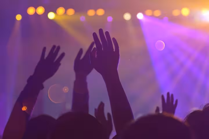 Party crowd dancing under club lights on Night Out at Little Buddha Hurghada with entrance and transport
