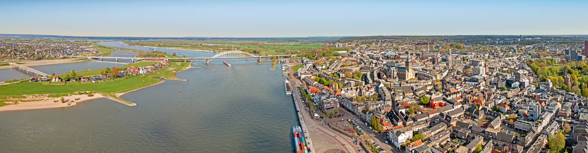 Aerial panorama of Nijmegen and Waal bridges, top viewpoint featured in the 1-day walking tour audioguide