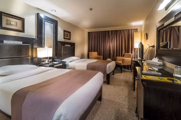 Twin cabin on Nile cruise ship from Luxor to Aswan, comfortable beds for 5-day Egypt tour stay