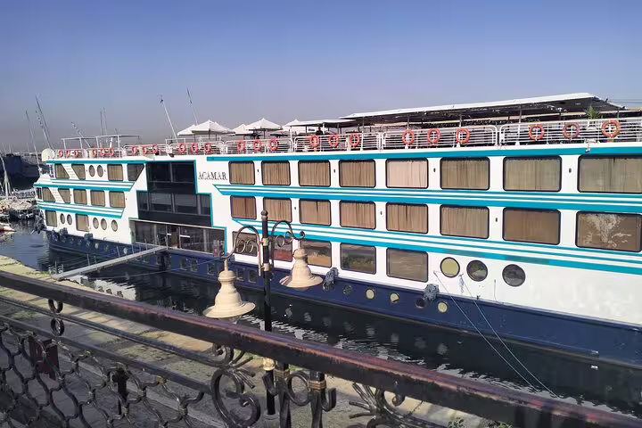 Docked Nile cruise ship in Cairo marina, ideal for 8-day Egypt tour with pyramids and river cruise