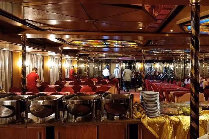 Buffet dining hall aboard a Cairo Nile River dinner cruise boat, set for evening meal and live entertainment