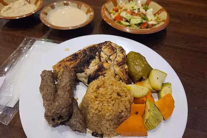 Grilled chicken, kofta, rice and mixed vegetables dinner plate on a Nile River dinner cruise with live music