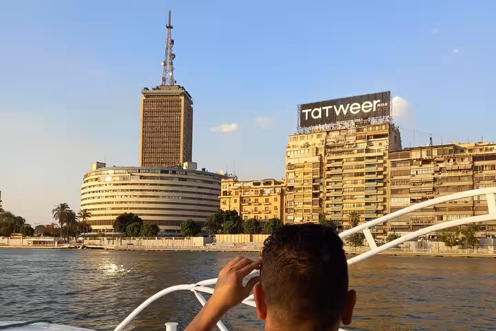 Nile felucca cruise view of Cairo skyline near Tahrir Square, part of private tour with Giza Pyramids and bazaar