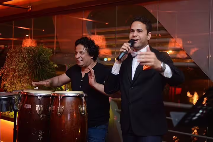 Live singer and percussionist performing onboard Nile Maxim dinner cruise in Cairo with oriental show